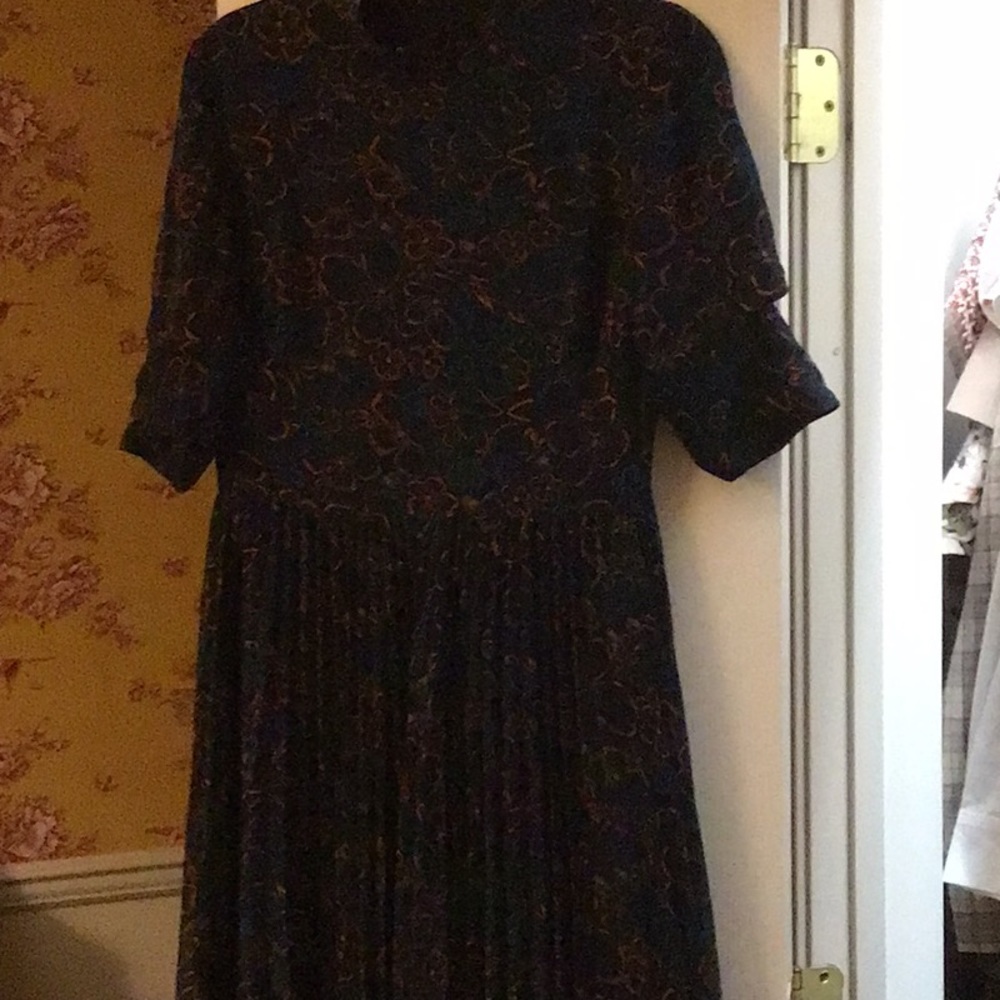 Asymmetrical pleated bottom short sleeve mock turtle neck navy dress.
